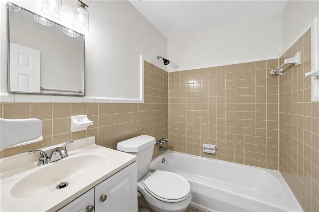 3193 East Point Street, Unit 4 Atlanta, GA 30344 - Photo 11 of 20 a bathroom with a sink mirror toilet and bathtub