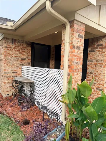 a view of a room with wooden floor and white walls