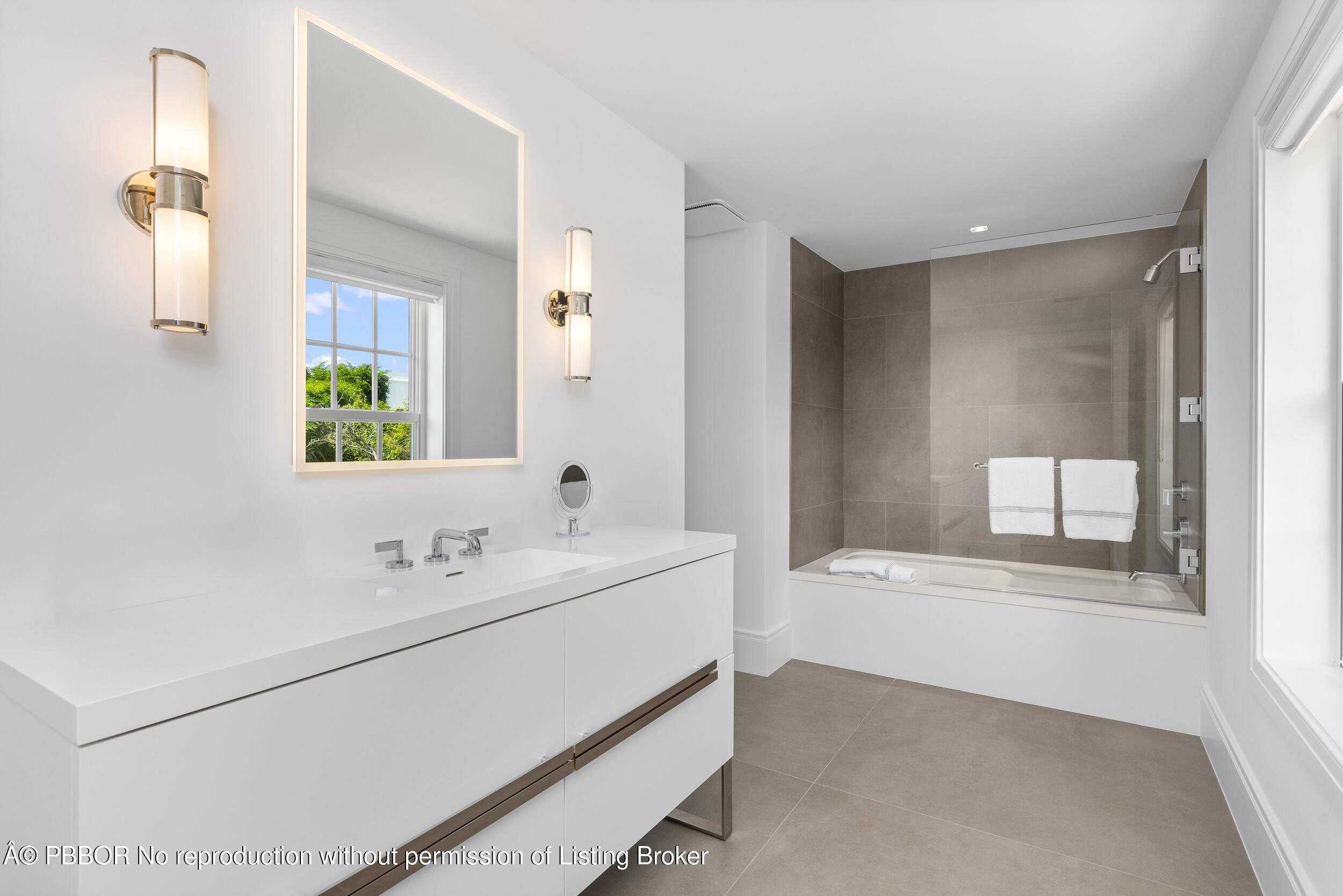 201 Banyan Road Palm Beach, FL 33480 - Photo 28 of 42 a bathroom with a double vanity sink window and mirror