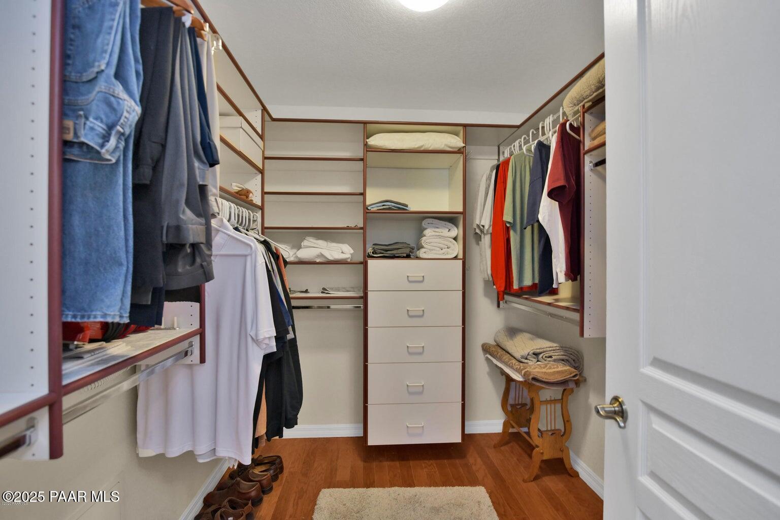 1716 Alpine Meadows Lane, Unit 1007 Prescott, AZ 86303 - Photo 11 of 21 a view of walk in closet with clothes and shoes