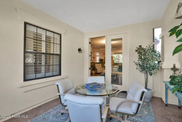 a living room with furniture and potted plant