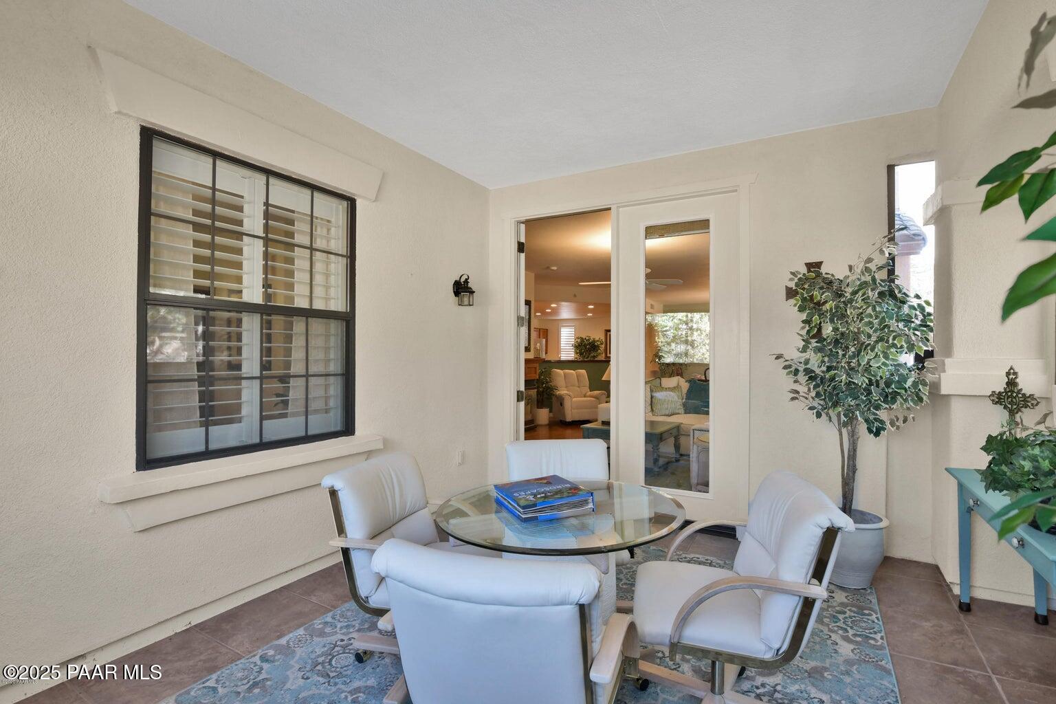 1716 Alpine Meadows Lane, Unit 1007 Prescott, AZ 86303 - Photo 17 of 21 a living room with furniture and potted plant