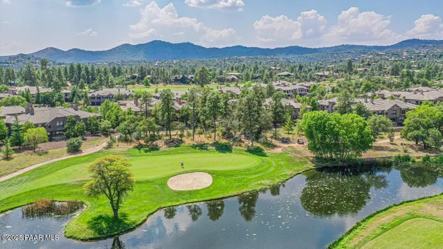 a view of a table and chairs in the garden