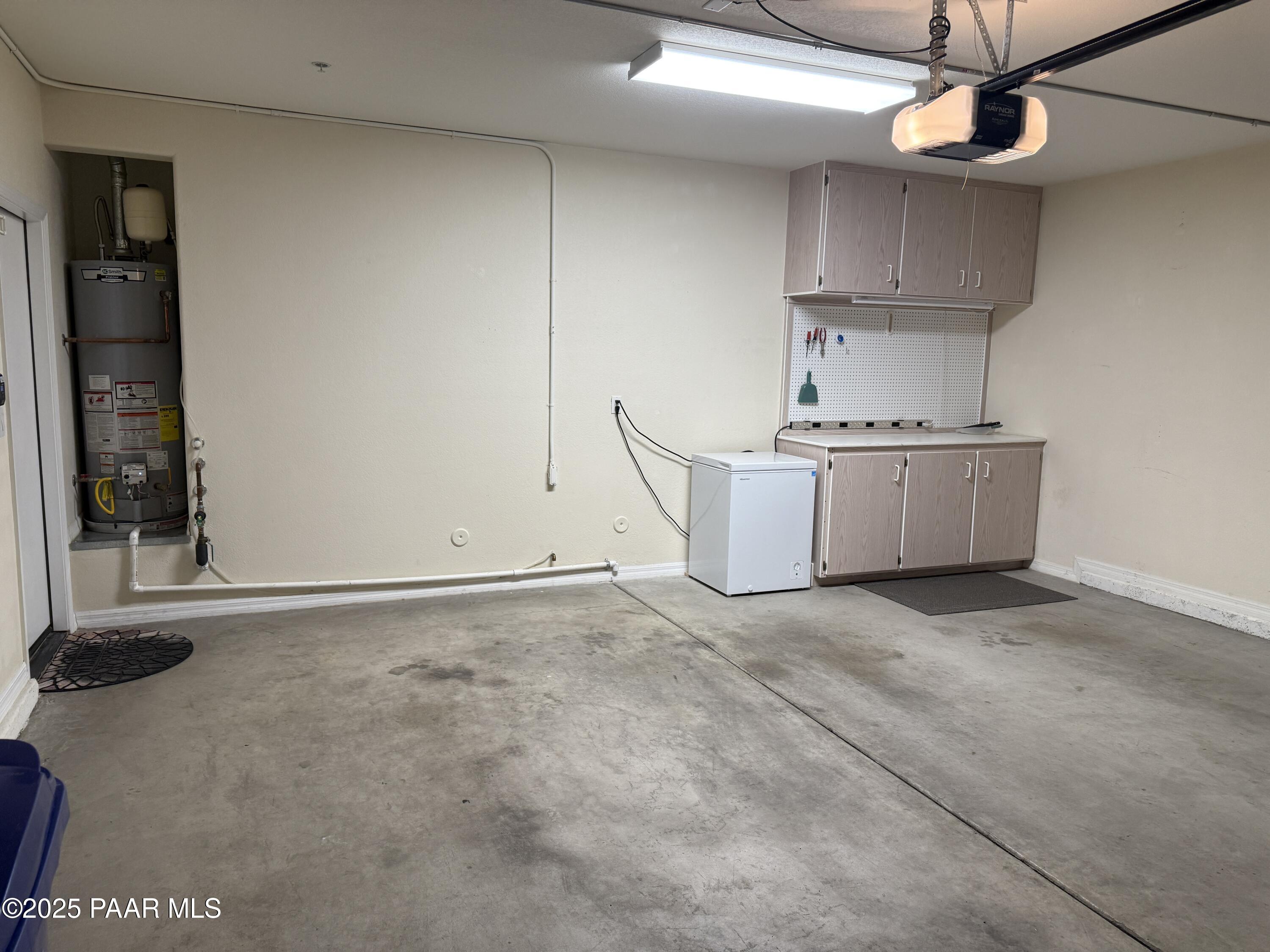 1716 Alpine Meadows Lane, Unit 1007 Prescott, AZ 86303 - Photo 21 of 21 a kitchen with stainless steel appliances granite countertop a stove a sink and a refrigerator with cabinets