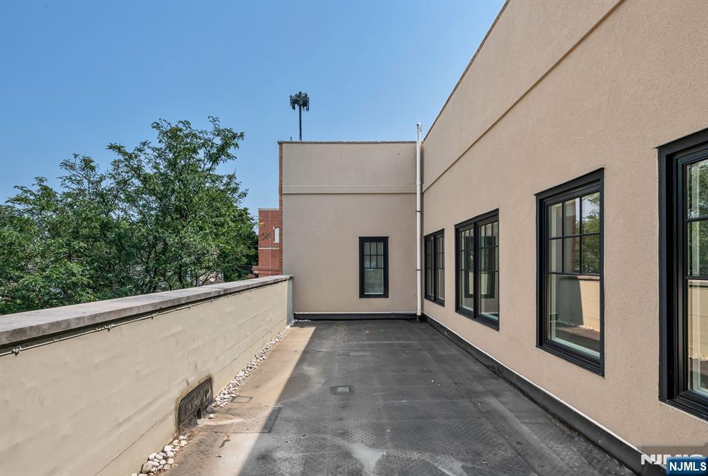 30 Jefferson Avenue, Unit C Westwood, NJ 07675 - Photo 7 of 9 a view of a porch with furniture and front door