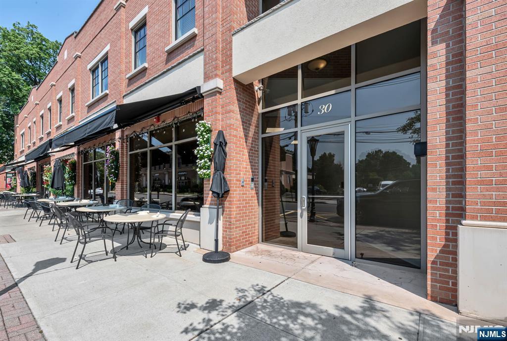 30 Jefferson Avenue, Unit C Westwood, NJ 07675 - Photo 9 of 9 a building outdoor space with porch and furniture