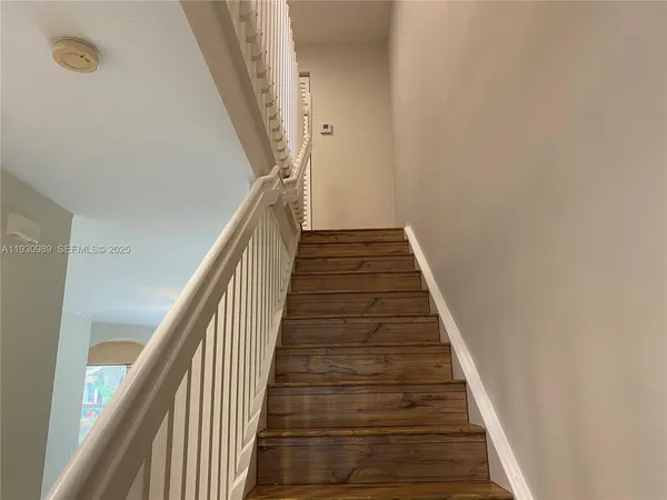 a kitchen that has a sink cabinets and window