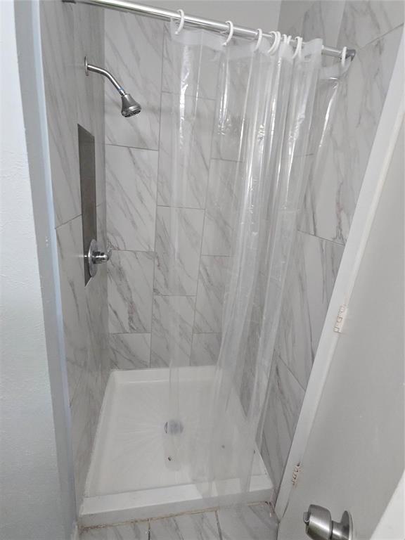 10500 Lake June Road, Unit I03 Dallas, TX 75217 - Photo 9 of 11 a close view of a bathtub in bathroom