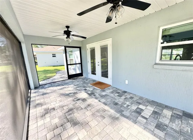 a view of a living room and floor to ceiling window