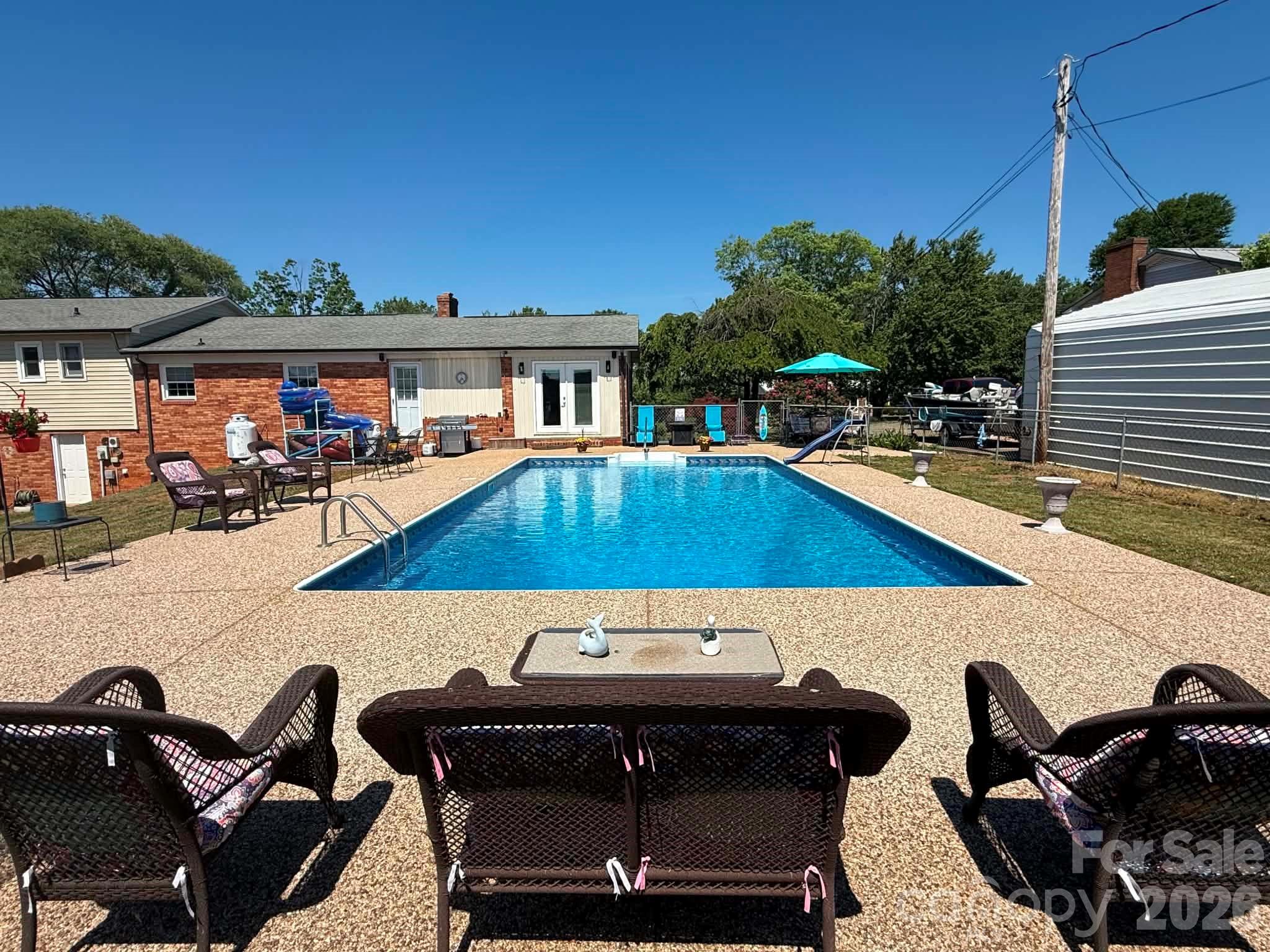 2121 Union Grove Road Lenoir, NC 28645 - Photo 7 of 38 a view of a swimming pool with chairs