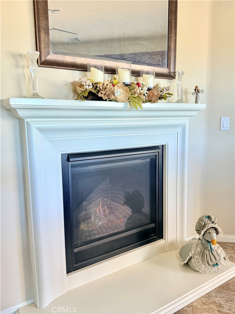 19422 Royal Oaks Road Apple Valley, CA 92308 - Photo 13 of 30 a closeup of a fireplace