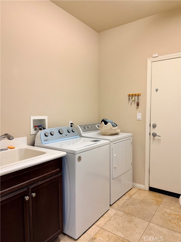 19422 Royal Oaks Road Apple Valley, CA 92308 - Photo 21 of 30 a utility room with dryer and washer