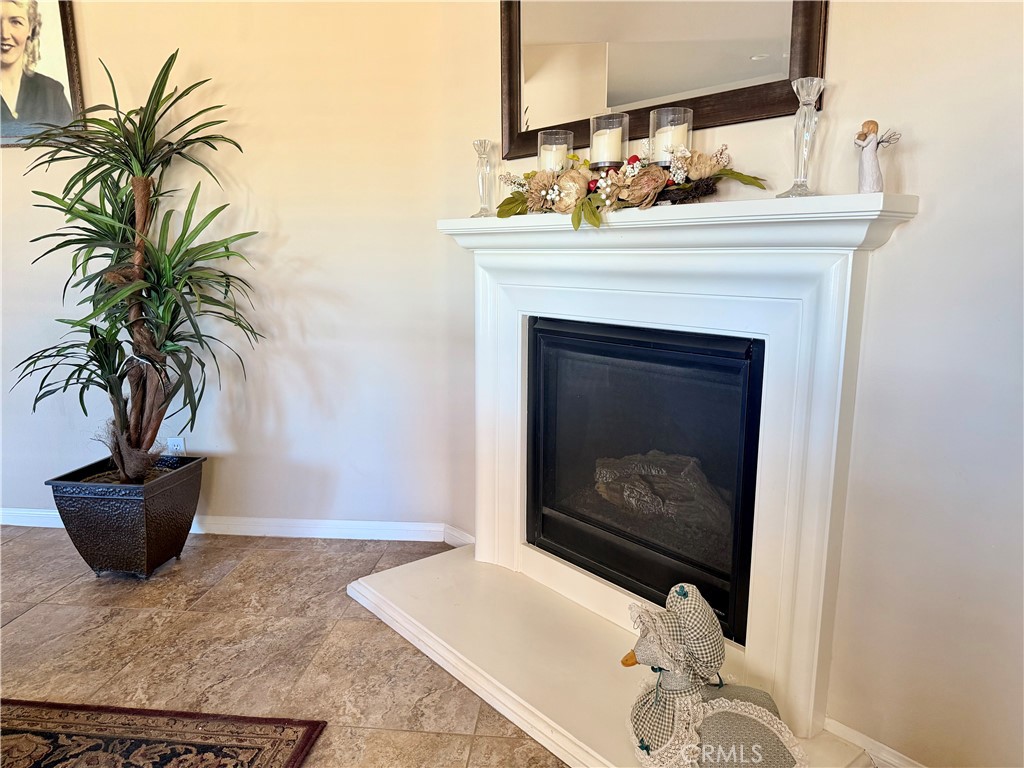 19422 Royal Oaks Road Apple Valley, CA 92308 - Photo 8 of 30 a living room with furniture and a fireplace