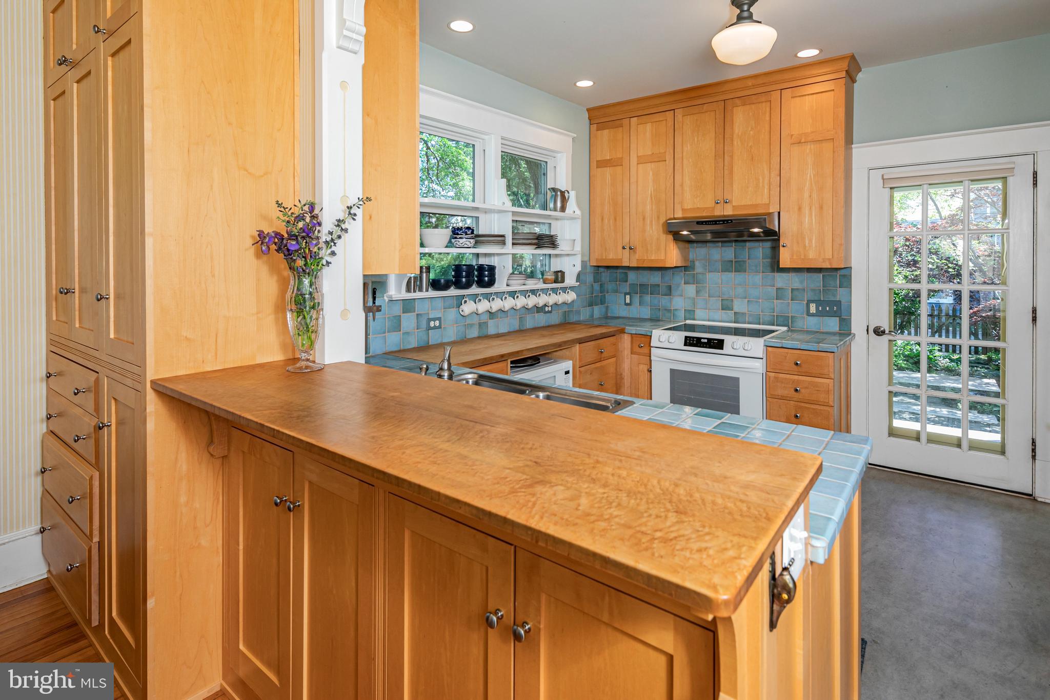 42 Markham Road Princeton, NJ 08540 - Photo 6 of 17 a kitchen with stainless steel appliances granite countertop a sink a stove and a refrigerator