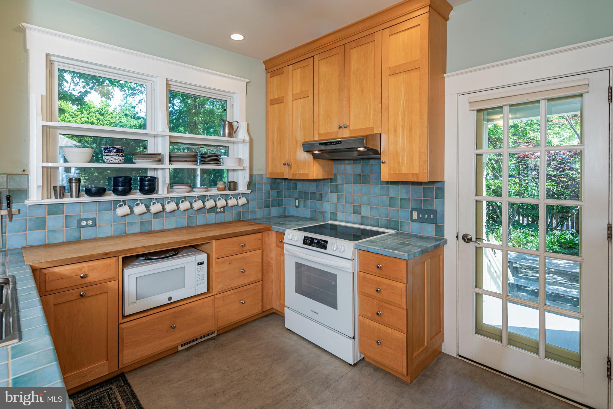 42 Markham Road Princeton, NJ 08540 - Photo 7 of 17 a kitchen with stainless steel appliances granite countertop a stove a sink and a microwave