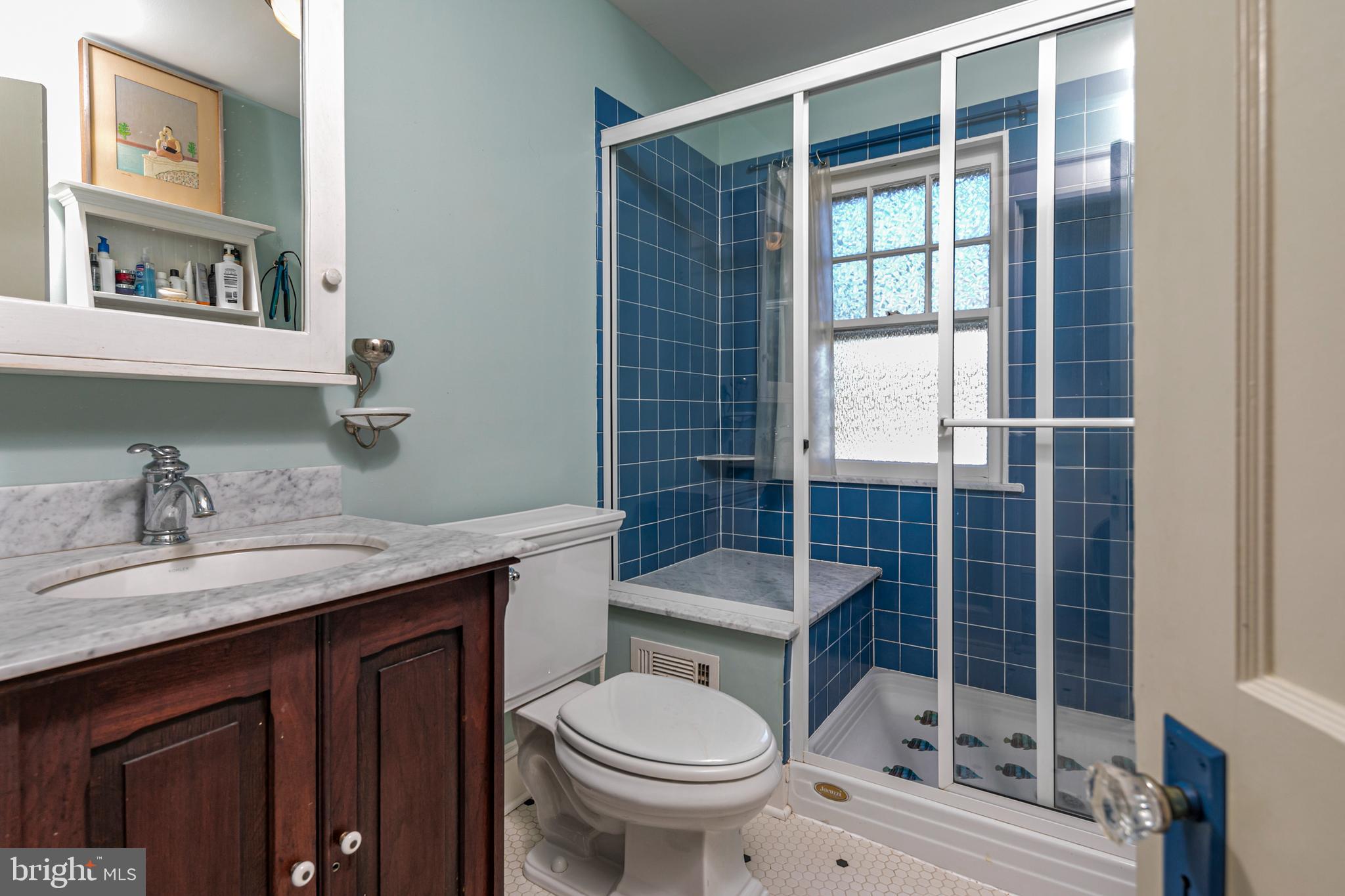42 Markham Road Princeton, NJ 08540 - Photo 10 of 17 a bathroom with a granite countertop toilet a sink and a shower