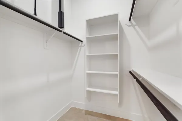 a view of an empty walk in closet