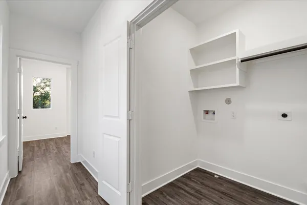 a view of hallway with wooden floor