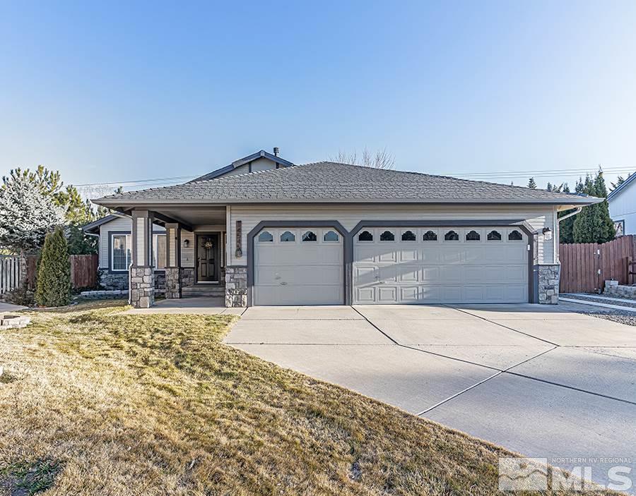 14545 Ghost Rider Drive Reno, NV 89511 - Photo 1 of 24 a front view of a house with yard