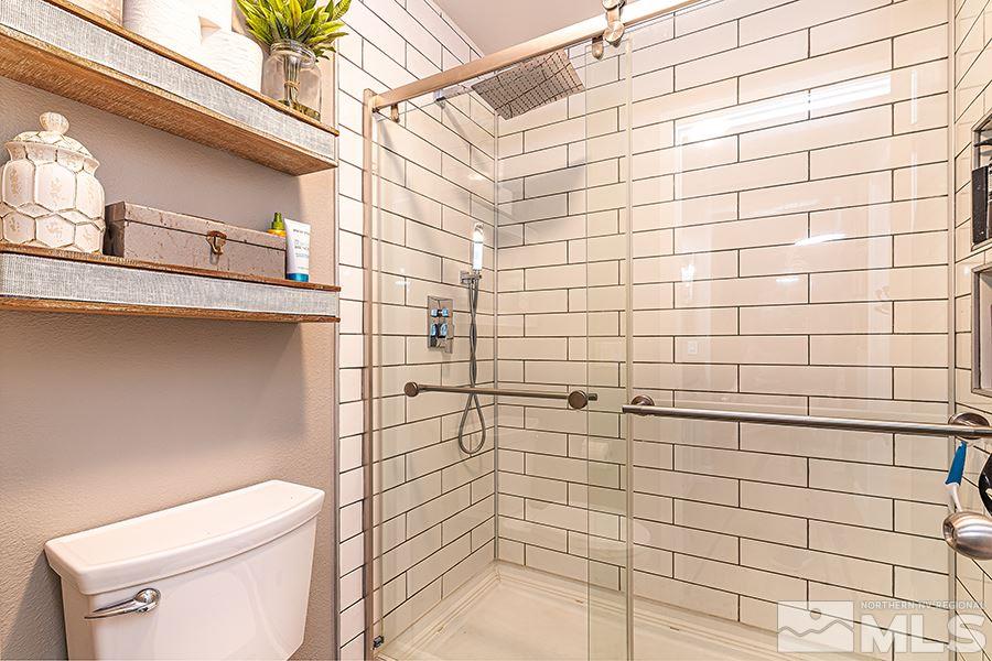 14545 Ghost Rider Drive Reno, NV 89511 - Photo 13 of 24 a bathroom with a shower