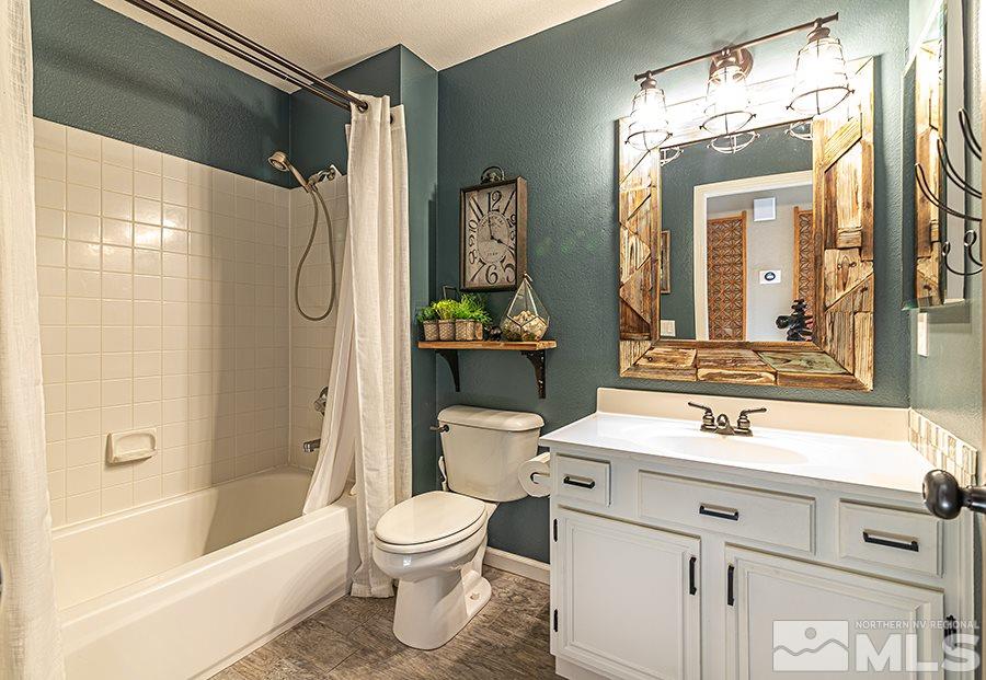 14545 Ghost Rider Drive Reno, NV 89511 - Photo 15 of 24 a bathroom with a sink toilet and shower