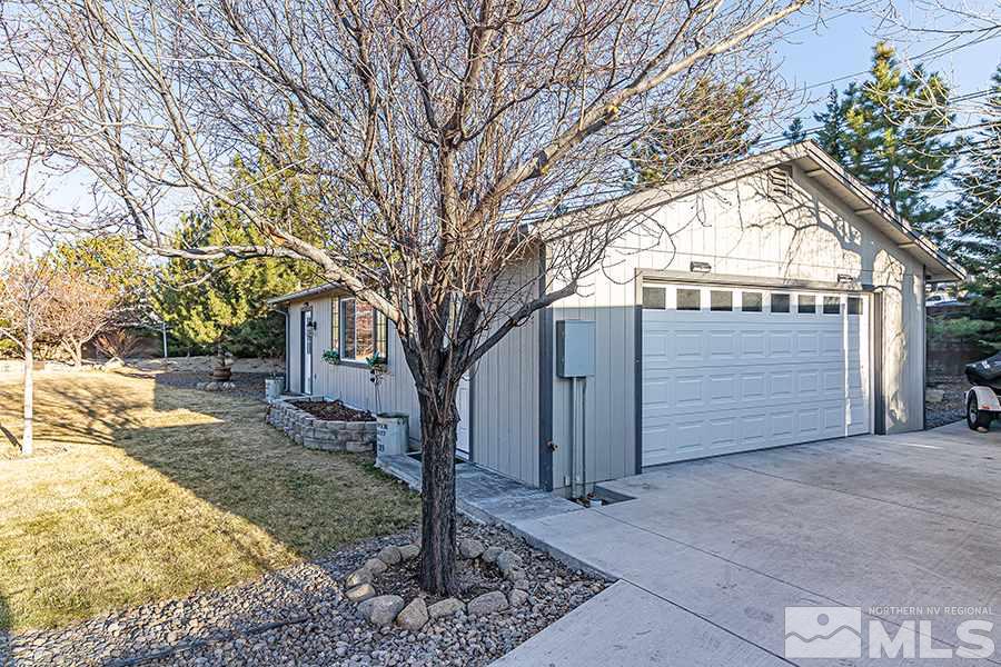 14545 Ghost Rider Drive Reno, NV 89511 - Photo 16 of 24 a view of a house with a large tree
