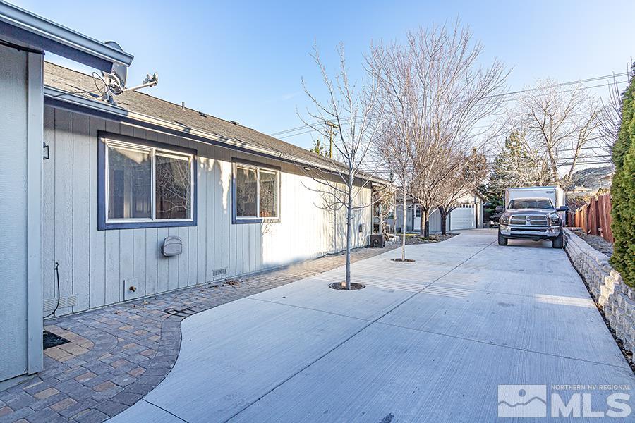14545 Ghost Rider Drive Reno, NV 89511 - Photo 20 of 24 a backyard of a house with outdoor seating