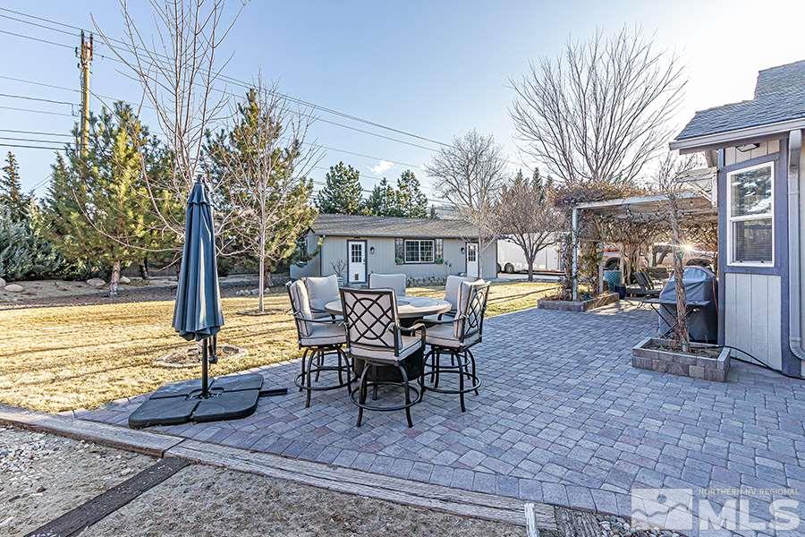 14545 Ghost Rider Drive Reno, NV 89511 - Photo 21 of 24 a view of a house with backyard and sitting area