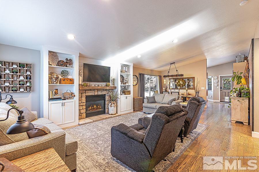 14545 Ghost Rider Drive Reno, NV 89511 - Photo 3 of 24 a living room with fireplace furniture and a flat screen tv