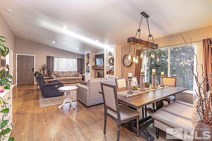 14545 Ghost Rider Drive Reno, NV 89511 - Photo 6 of 24 a view of a dining room with furniture window and wooden floor