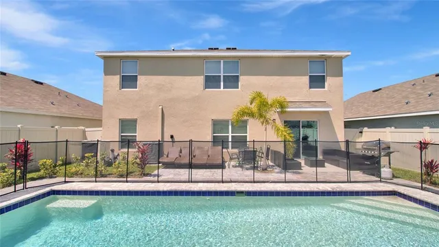 a front view of a house with a yard table and chairs