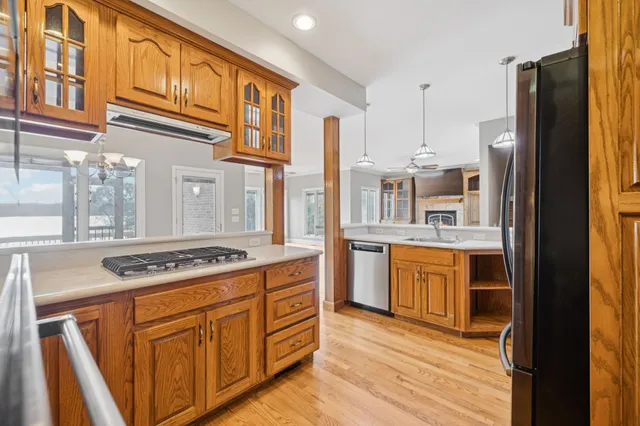 a view of an empty room with a ceiling fan