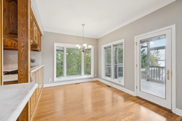 an empty room with a ceiling fan and a window