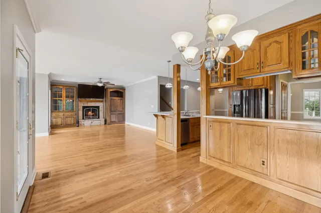a bathroom with a sink mirror and vanity