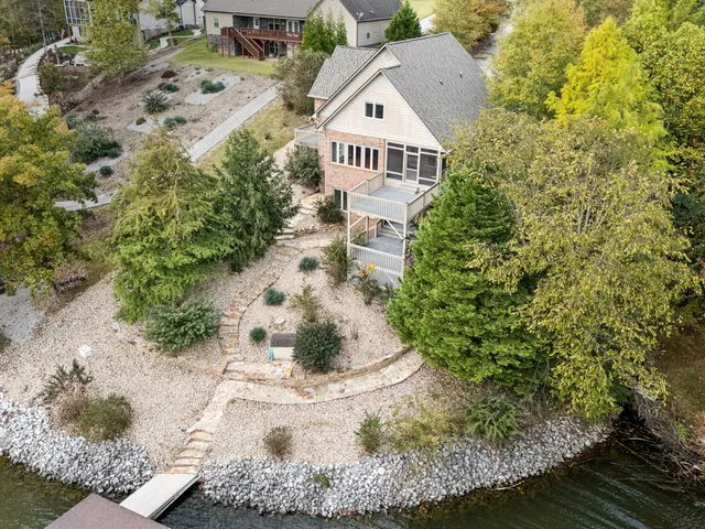 a view of a brick house with a large window