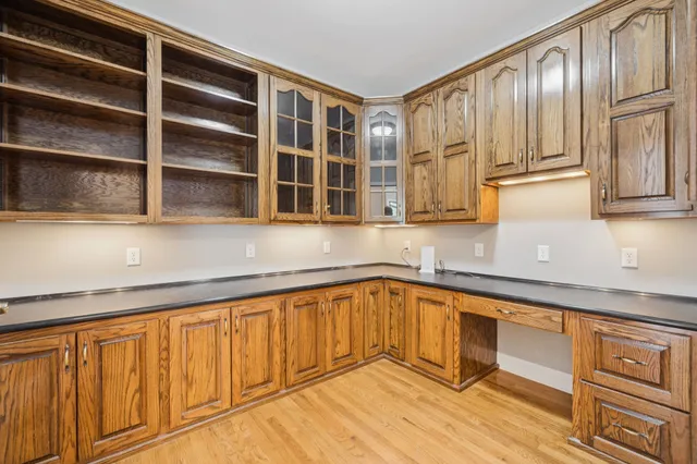 an aerial view of a house with outdoor space and lake view