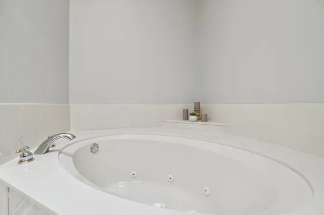 a view of a house with a wooden deck