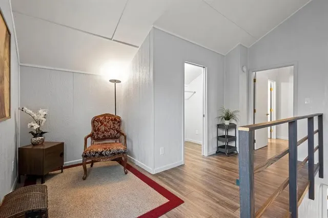 a room with furniture and wooden floor