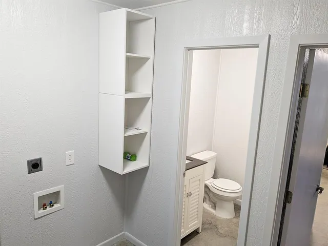 a bathroom with a shower and a window