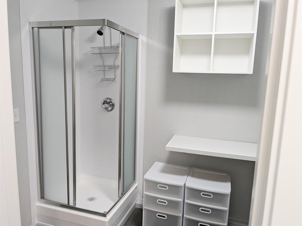 5019 North State Highway Bonham, TX 75418 - Photo 27 of 28 a bathroom with a shower and a window