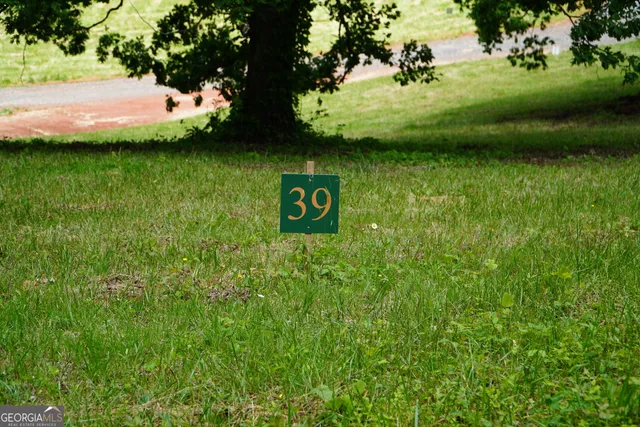 a view of a wooden fence and trees