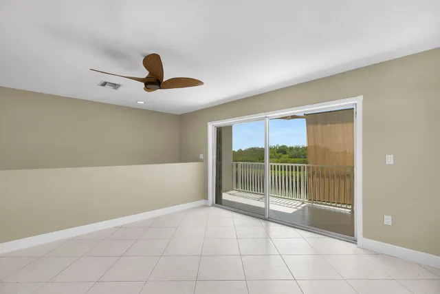 a view of an empty room with stairs