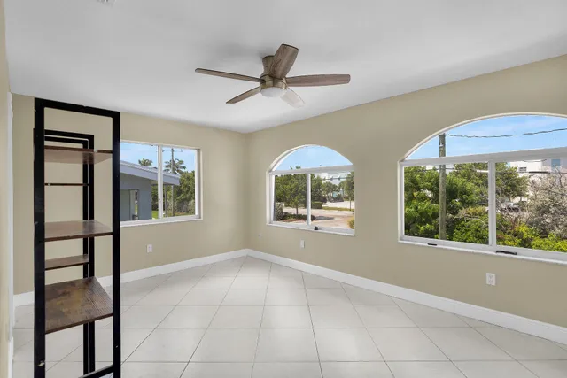 an aerial view of a house with a lake view