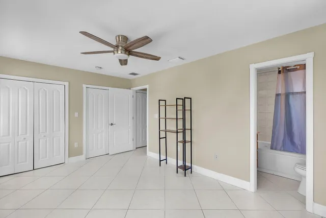 an aerial view of a residential houses with outdoor space and river