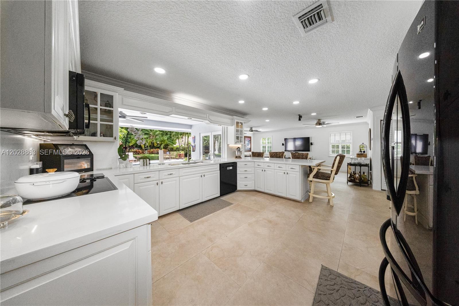 15351 Southwest 146th Street Miami, FL 33196 - Photo 15 of 86 Kitchen with large snack counters and opens to the oversized family room - just ideal when entertaining.