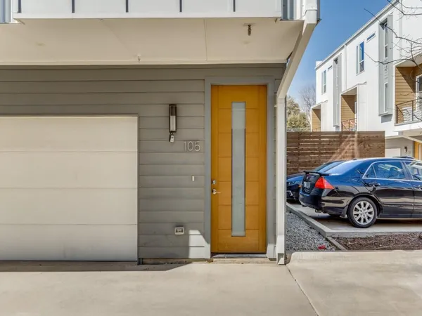 a view of a car parked in front of a house