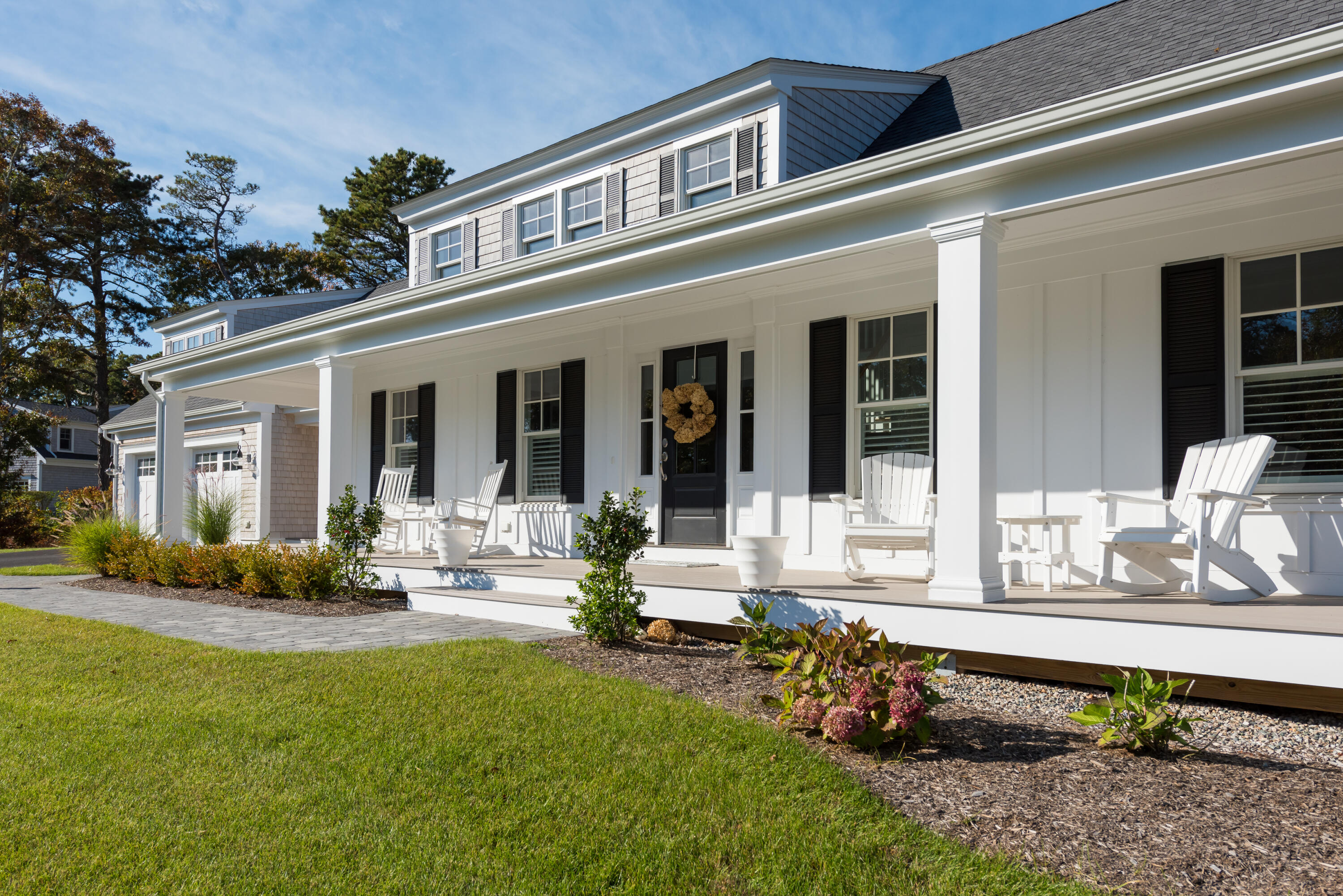 15 Bascom Hollow Harwich, MA 02645 - Photo 13 of 35 a front view of a house with porch and garden