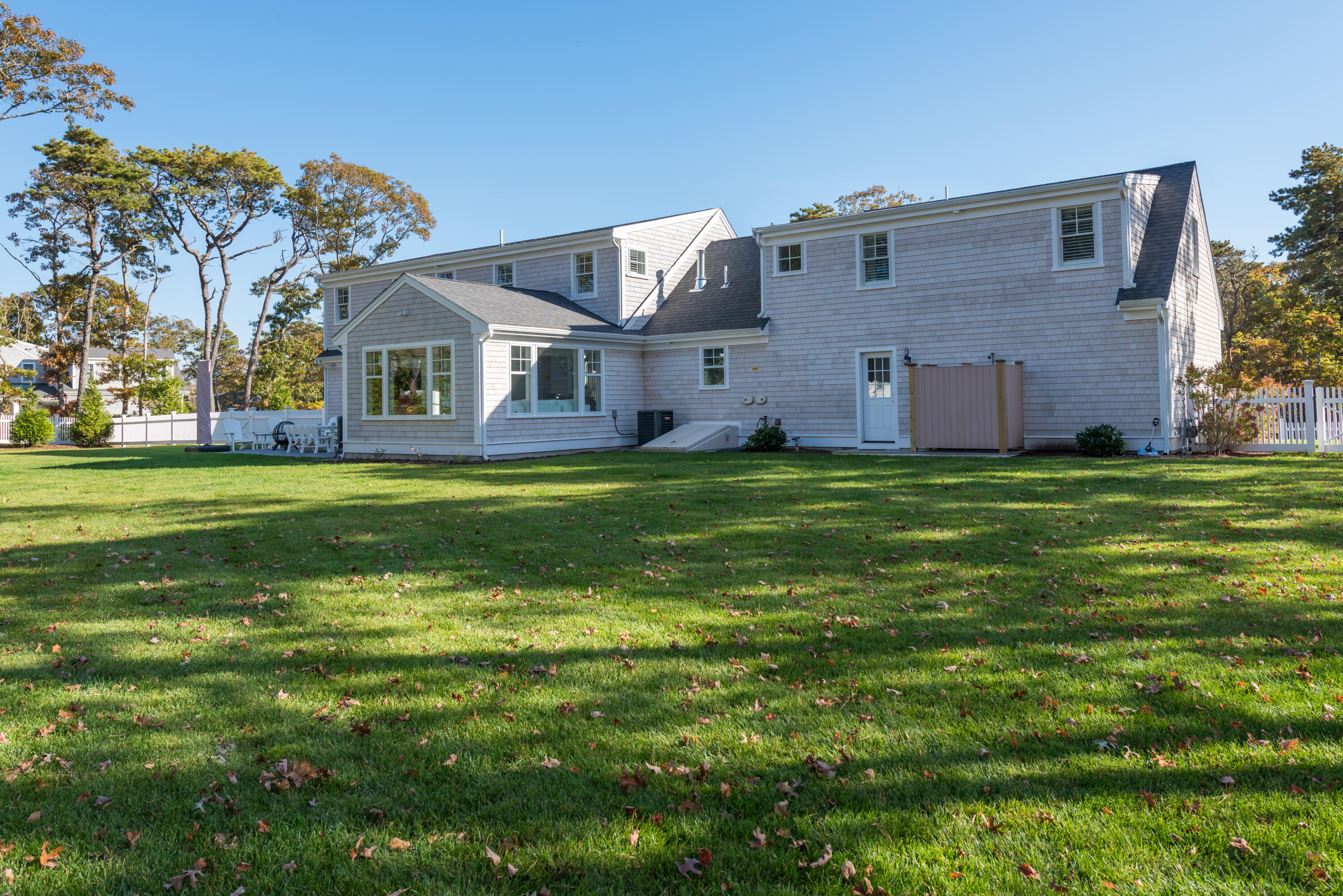 15 Bascom Hollow Harwich, MA 02645 - Photo 7 of 35 a view of a big house with a big yard and large trees