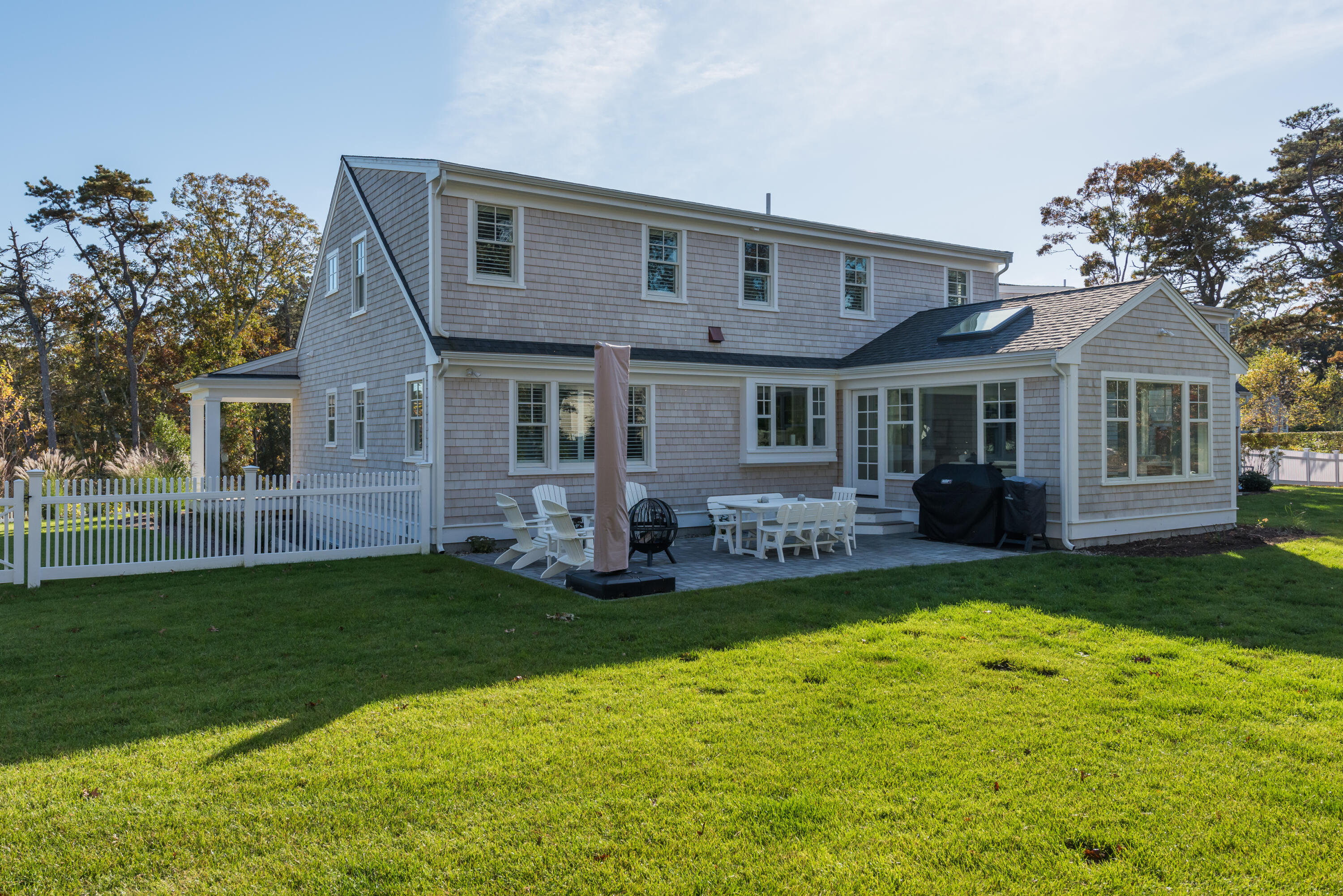 15 Bascom Hollow Harwich, MA 02645 - Photo 8 of 35 a front view of a house with a garden and yard