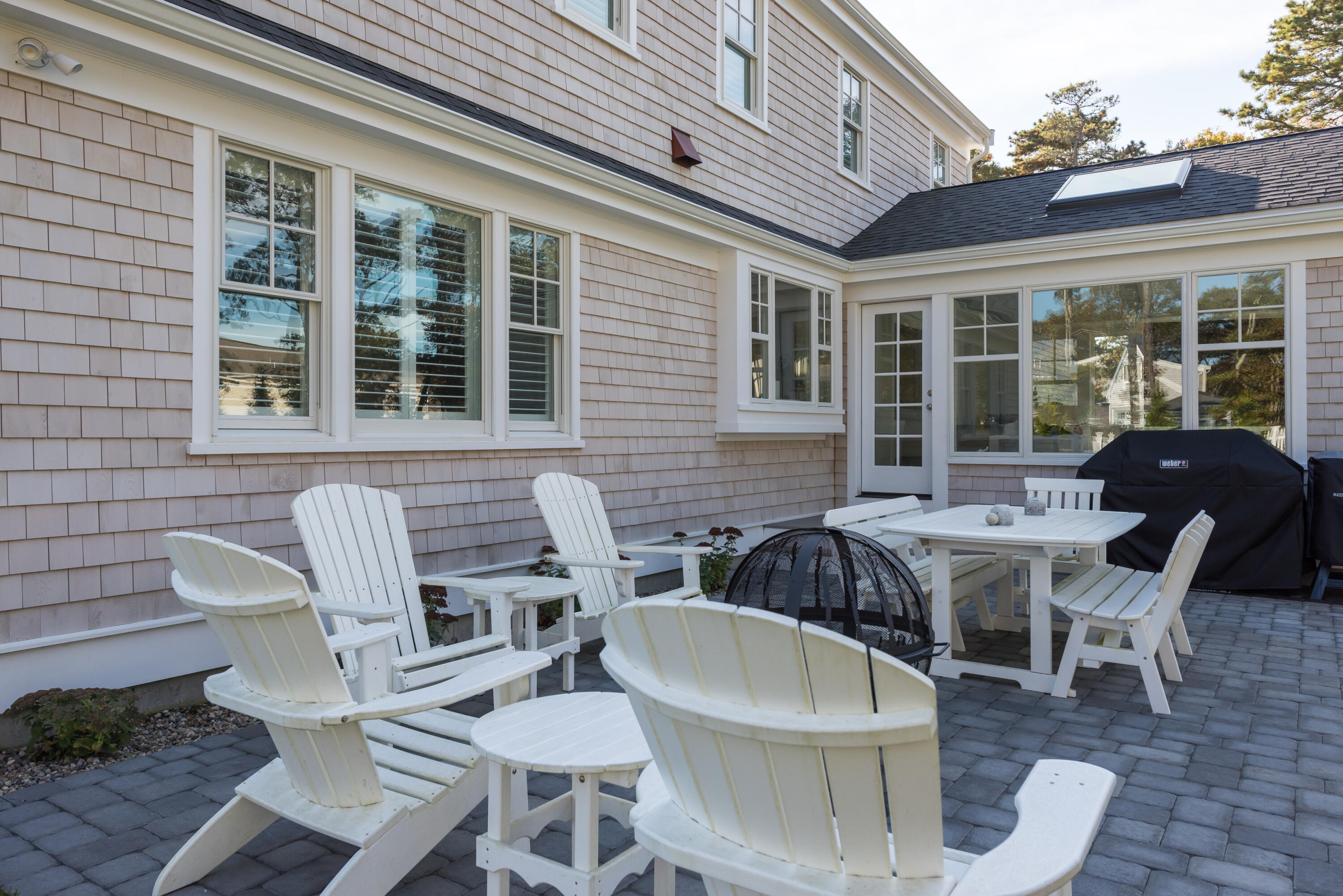 15 Bascom Hollow Harwich, MA 02645 - Photo 9 of 35 a view of a patio with table and chairs